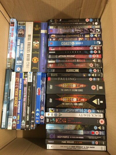 Four boxes of DVDs and BluRays.