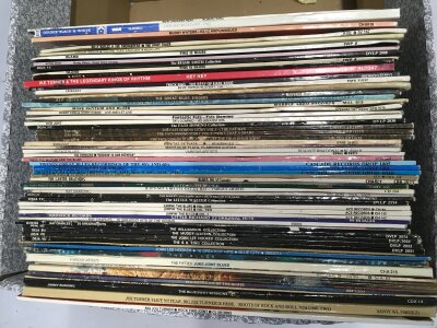 A bag of blues LPs by various artists including Sonny Boy Williamson, Albert King, Big Joe Turner and others.