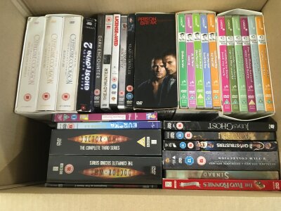 Four boxes of DVDs including box sets.