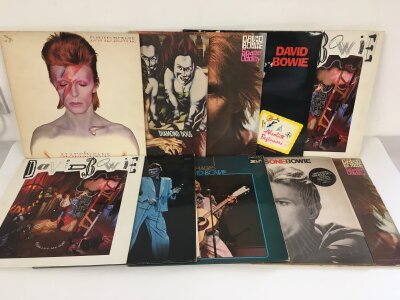 Ten David Bowie LPs and 12" singles comprising Aladdin Sane, Diamond Dogs, Absolute Beginners and others.