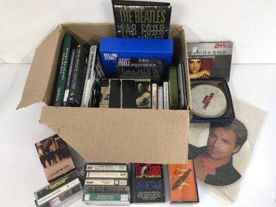 A box of CD box sets, audio cassettes etc by various artists including The Beatles, Genesis, Pink Floyd and others.