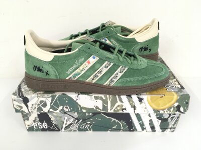 A pair of boxed and unworn Mani signed Adidas Spezial trainers, limited to 200 worldwide, this being number 16. Comes with original box, certificate and photo of Mani. UK size 10.5.