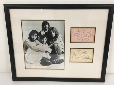 A framed and glazed fully signed Who display with the signatures of Roger Daltrey, Pete Townsend, John Entwhistle and Keith Moon. No COA.