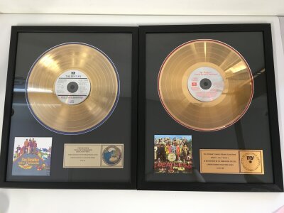 Six framed Beatles CD displays plus a framed Hard Day's Night film cel display (7). Largest approx 44cm x 54cm.