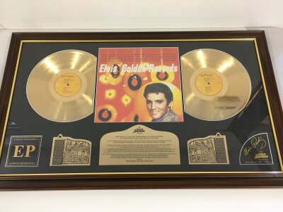 A framed limited edition Elvis Presley double gold disc display plus a further framed gold disc and CD display (3).