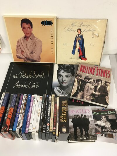 A collection of music memorabilia comprising DVDs, CDs, books etc.
