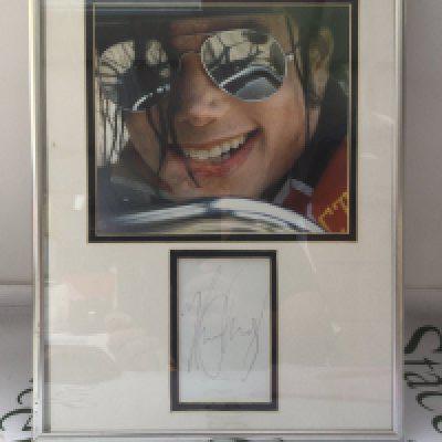 A framed and glazed signed Michael Jackson display, approx 31cm x 41cm. No COA.
