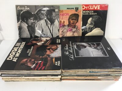 A collection of jazz LPs by various artists including Count Basie, Art Tatum, Stan Getz and many more.