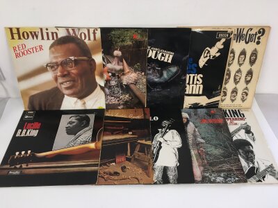Two bags containing twenty blues LPs by various artists including Howlin Wolf, BB King, Elmore James and others.