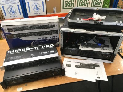 Three rack mounts comprising two Behringer EP1500 power amps and a boxed Behringer Super X Pro CX2310 (3). Some manuals and leads included.