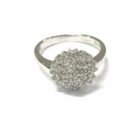 A 9ct white gold diamond cluster ring. Size M and 3.28g Postage A