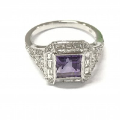 An 18ct white gold art deco style ring set with a square princess cut amethyst surrounded by baguette cut and round cut diamonds with diamond shoulders. Diamonds 0.61ct approximately. Size M 1/2. Postage A