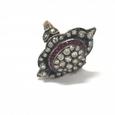 An 8ct rose gold navette shaped dress ring set with calibre cut rubies and various cut diamonds. Diamonds approx 0.75ct and rubies 0.48ct approx. Size O. Postage B