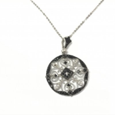 An ornate open work silver pendant set with black and white CZ on a silver chain.