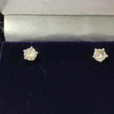 A pair of 18ct white gold 5 claw set diamond solitaire studs. Comes with gemological report. Postage B