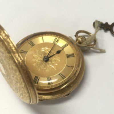An 18ct gold fob watch , with key . Postage category A