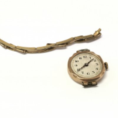 A 9ct gold cased watch with a rolled gold strap. Postage A