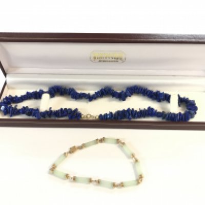 A boxed 9 karat gold jade bracelet and a lapis 9 karat gold necklace