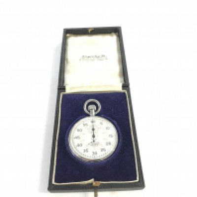 A boxed Minerva Majex silver stopwatch.