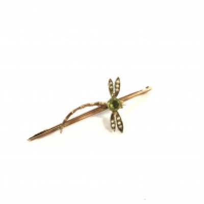 A 9 karat gold peridot and seed Pearl dragonfly broach.