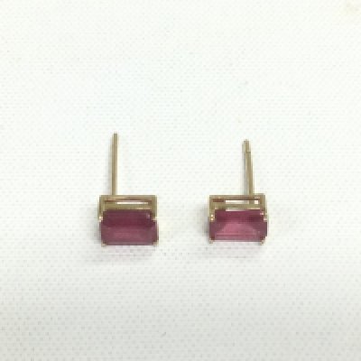 A pair of 9ct gold earrings set with rubies, approx 0.7g. Shipping category D.- NO RESERVE
