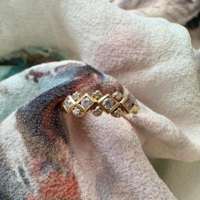 An unmarked high carat diamond fancy style ring, Approx weight 2.10 grams. Size J 1/2.