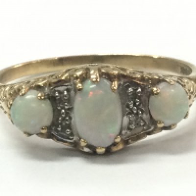 A three stone opal set ring , 1.99g total weight. Size S Postage category A