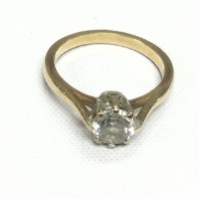 A 9ct gold and CZ solitaire ring, approx 3g and approx size N. Shipping category A.