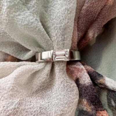 A platinum solitaire ring set with a rectangular cut diamond Approx 0.61cts. Approx weight 6.53 grams, size L.