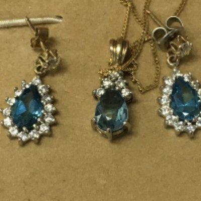 A aquarium pear shaped pendant with diamonds mounted on a 9ct gold chain with a matching Pair of earrings.