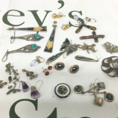 A collection of costume and silver jewellery items comprising earrings, pendants etc. Shipping category A.