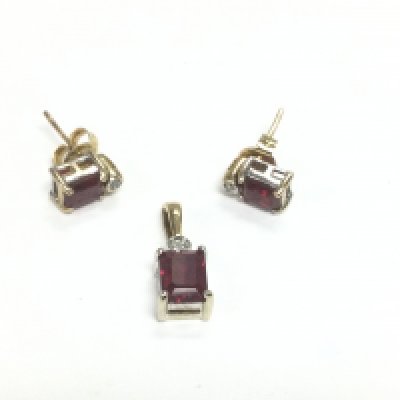 A 9ct gold, synthetic ruby and diamond jewellery suite comprising a pendant and pair of earrings, total approx weight 2.5g. Shipping category A.