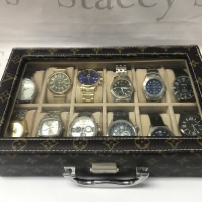 Twelve Gents watches including Citron, Sekonda etc all seen working. With Louis Vuitton style display case. Postage category B