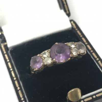 A 9ct gold amethyst and diamond ring , size N ,3.5g total weight. Postage category A