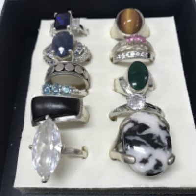 Silver stone set rings and a silver band ring. Postage category A