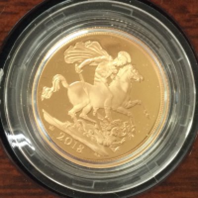 A 2018 gold proof sovereign with box and COA. Postage B