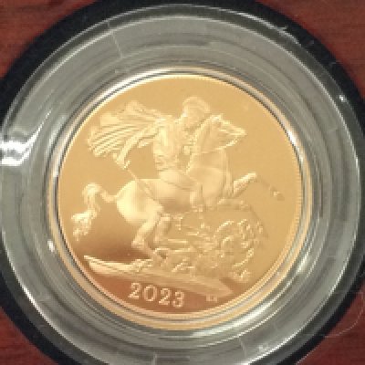 A 2023 gold proof sovereign with box and COA. Postage B