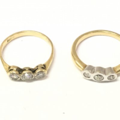 Two 18ct gold three stone diamond rings. Sizes N and O 6.3g Postage A