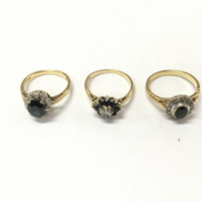 Three 18ct gold diamond and sapphire cluster rings. Size K 1/2 and M. 10.34g Postage A