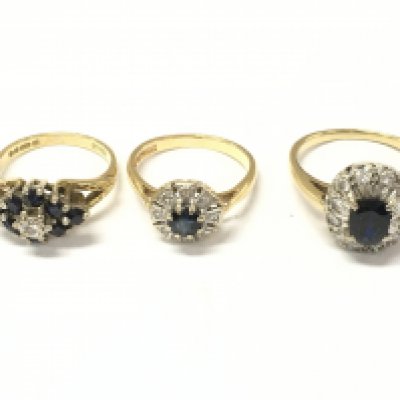 Three 18ct gold diamond and sapphire cluster rings. Size K 1/2 and M. 11.39g Postage A