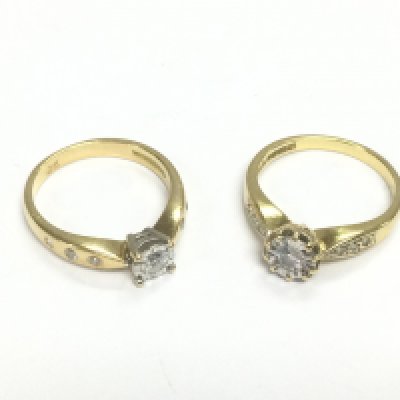 Two 18ct gold diamond solitaire rings set with diamond shoulders, approx sizes K-L and L. Approx total weight 7g. Shipping category A.