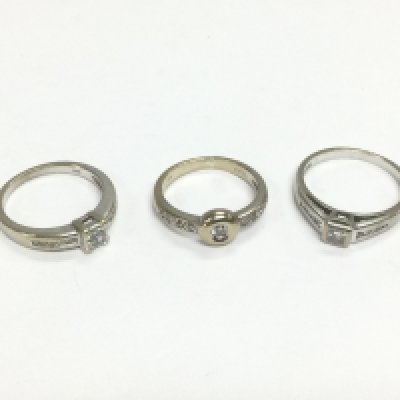 Three 18ct white gold solitaire diamond rings set with further diamonds to the shoulders, approx sizes L, N and O. Total approx 11g. Shipping category A.