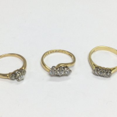 Three 18ct gold three stone diamond ring, approx sizes L and L-M. Total approx 8.4g. Shipping category A.