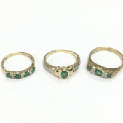 Three 9ct gold rings set with diamonds and emeralds, approx sizes J, N and O. Total approx 6.3g. Shipping category A.