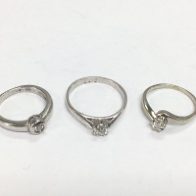 Three 9ct white gold diamond solitaire rings, approx sizes J, Q and K. Total approx 7.4g. Shipping category A.