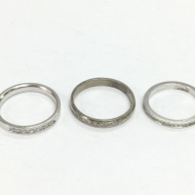 Three unmarked white gold half hoop diamond rings, approx sizes N, O and L. Total approx 9.7g. Shipping category A.