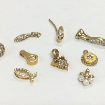 Nine gold diamond cluster pendants, total approx 10.4g. Shipping category A.