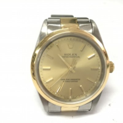 A gents Rolex oyster perpetual with bi colour case and strap. Case 34mm. Watch seen running. Comes with Rolex box (no cushion) and a service card. Circa 2001