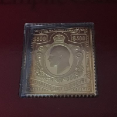A collection of silver gilt Hallmarked Replica stamps The Empire collection 25 stamps in original packaging sold with a presentation fitted box.