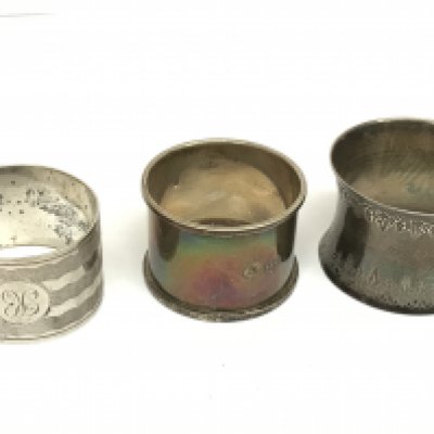 Silver hallmarked napkin rings, one not marked. Postage category A